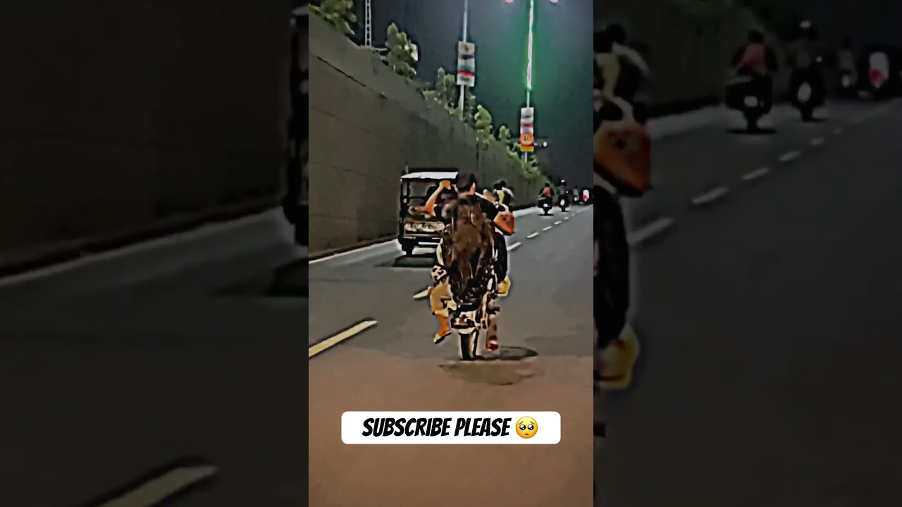 One wheeling with girl on Honda 125