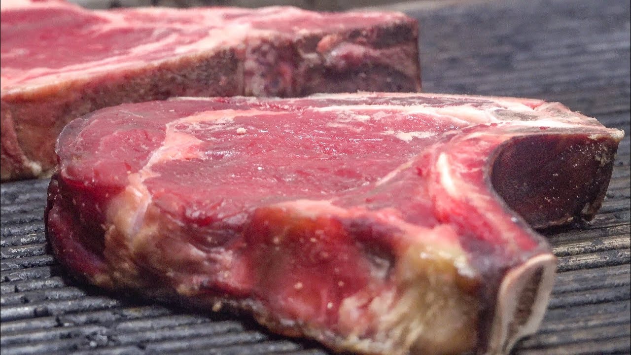 Huge Steaks of Italian Beef on Grill. Turin, Italy. Street Food