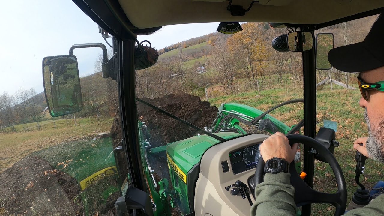 Moving dirt with the John Deere 3039R and Dion dump wagon