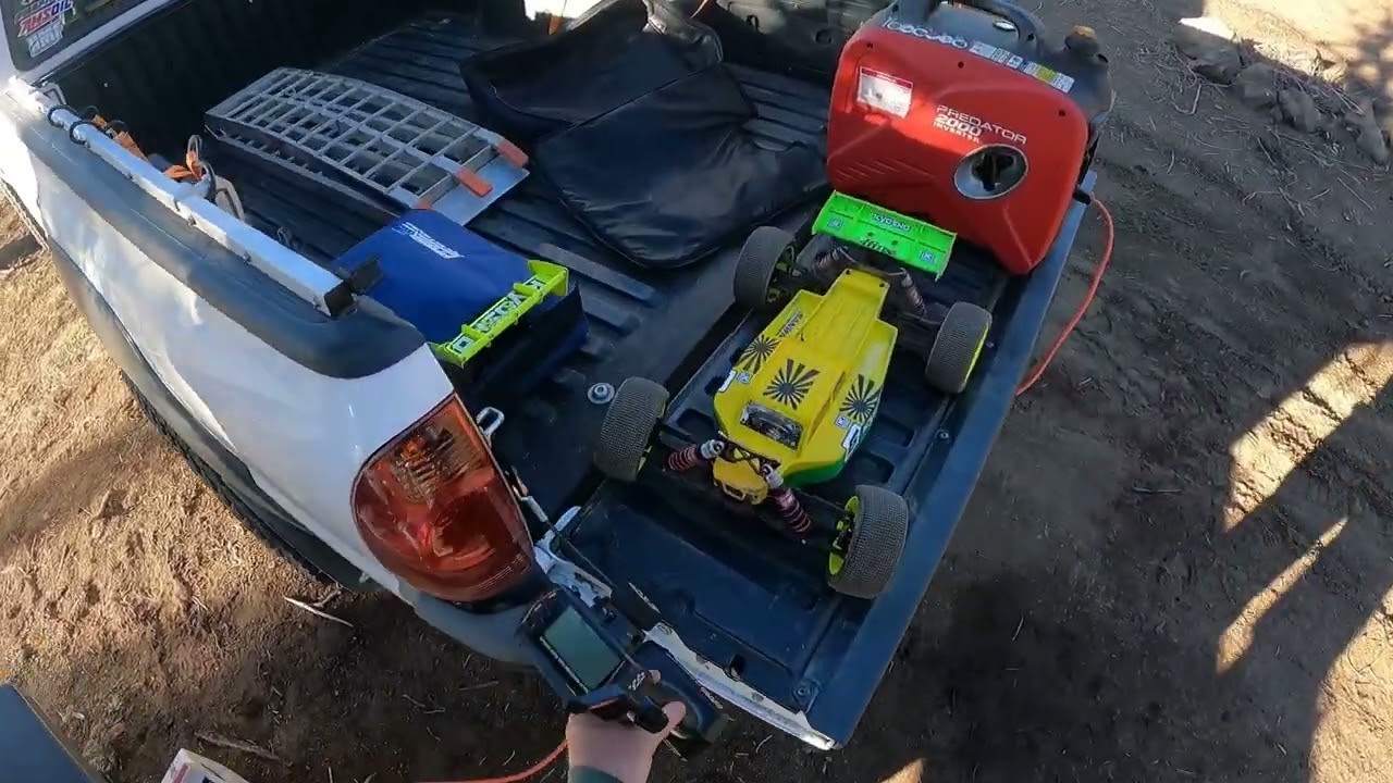 Kyosho MP10 E-Truggy and Nitro buggy at the moto parking area