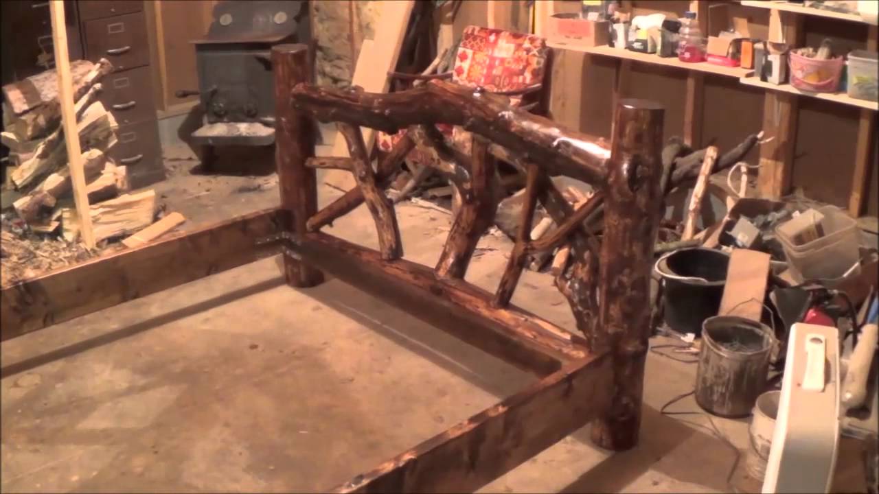 THE LOG BED. Varnishing. The bed is complete except for the mattress, box spring and a comforter.