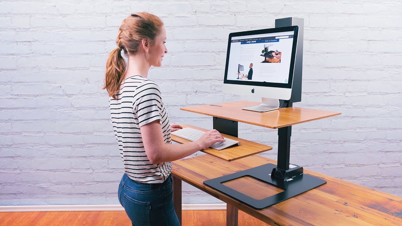 The E7 Electric Standing Desk Converter by UPLIFT Desk