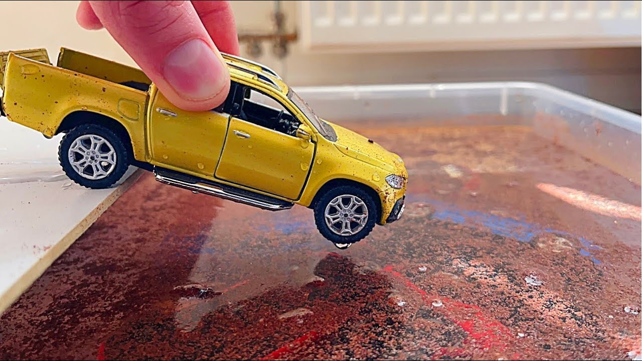Diecast Cars Sliding Into The Spicy Water