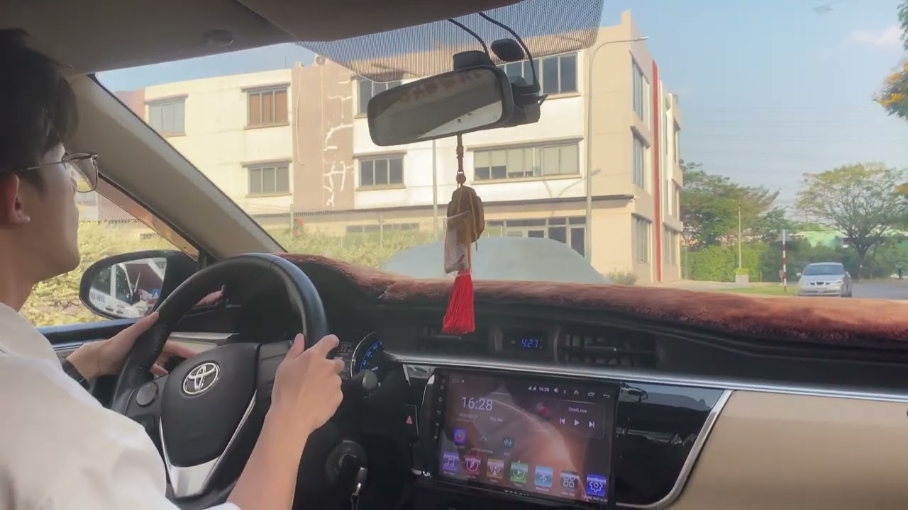 Driving MT Corolla Toyota in residential area on a nice beautiful sunny day