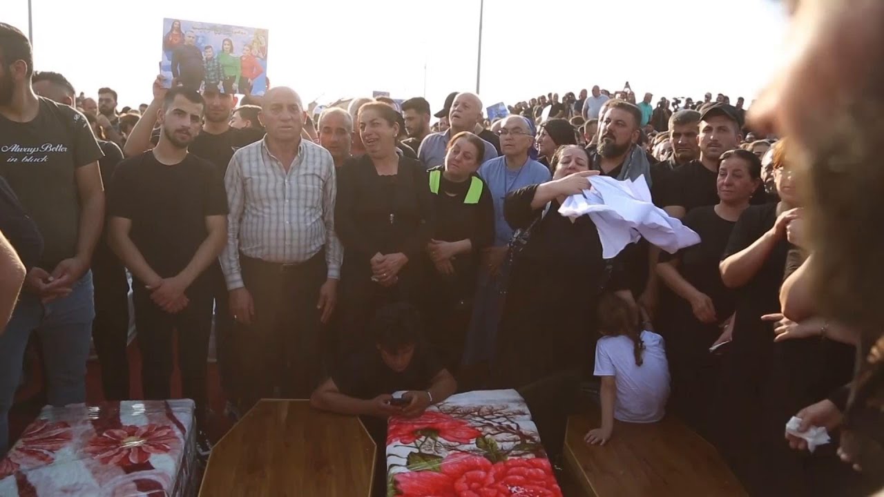 Hundreds attend burial ceremony in northern Iraq to mourn those who died in wedding hall fire