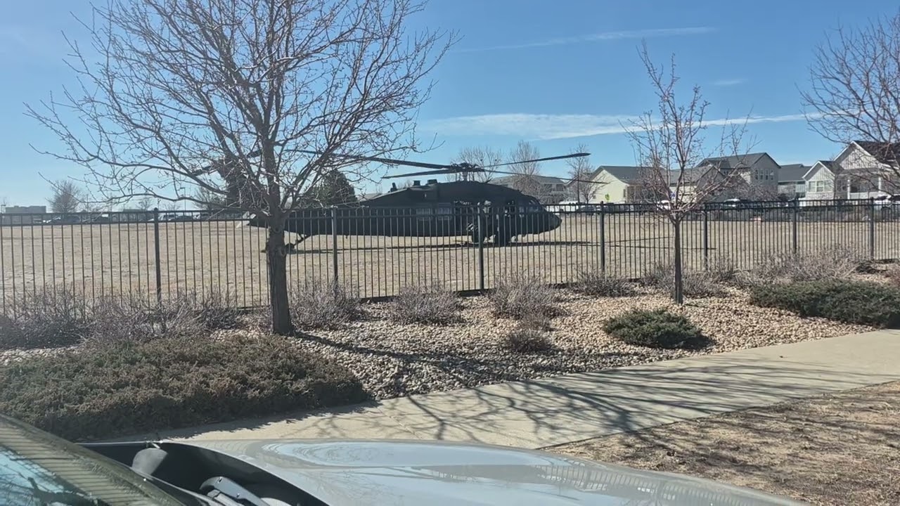 Black hawk helicopter takeoff from school