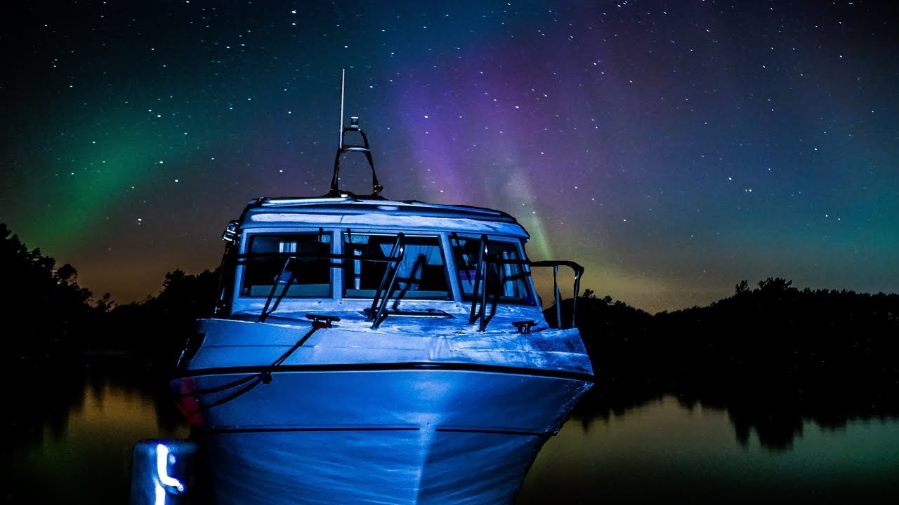 Boating and fishing under the Northern Lights in Norway