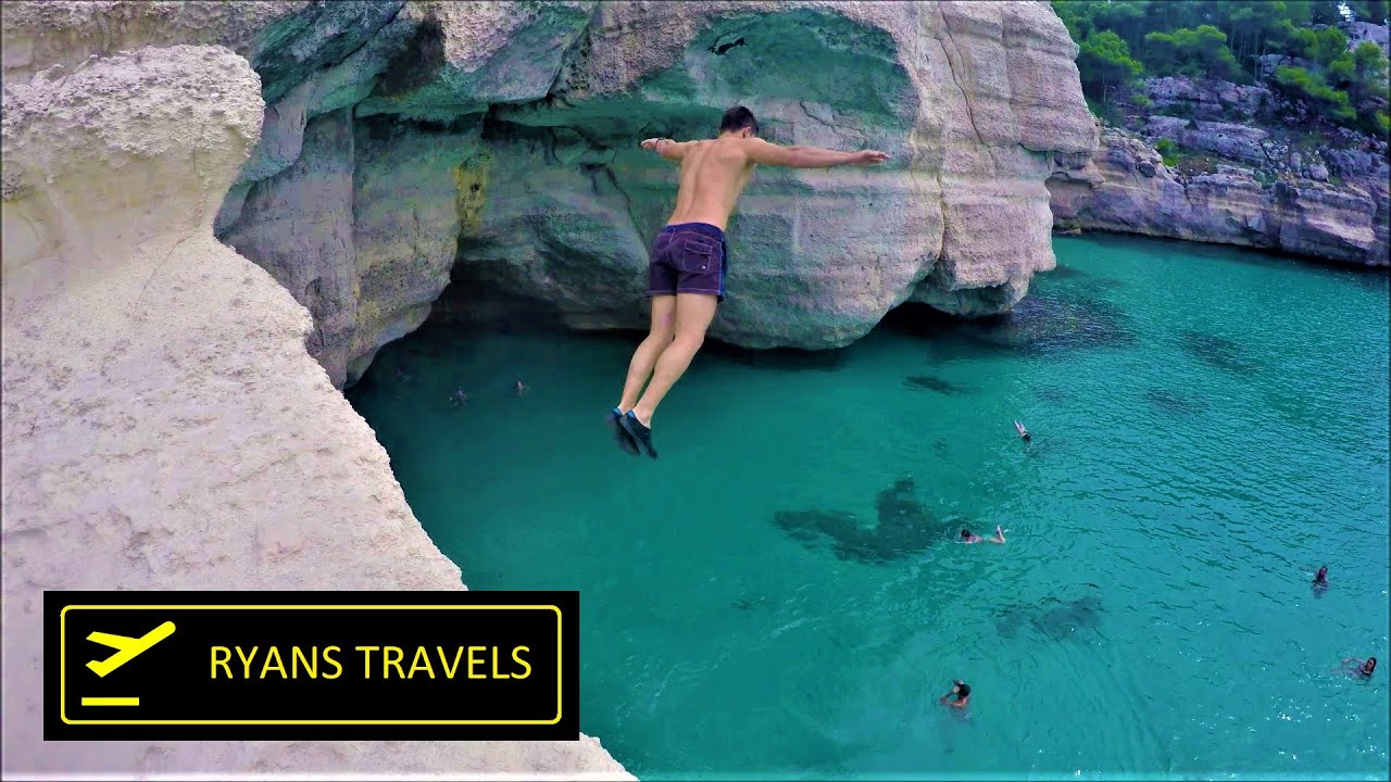 Cliff Base Jumping into Sea in Menorca, Cala Mitjana Ryans Travels