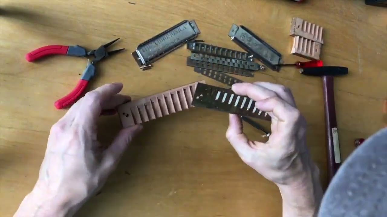 Replacing the wood comb on a Hohner Chromonica chromatic harmonica.