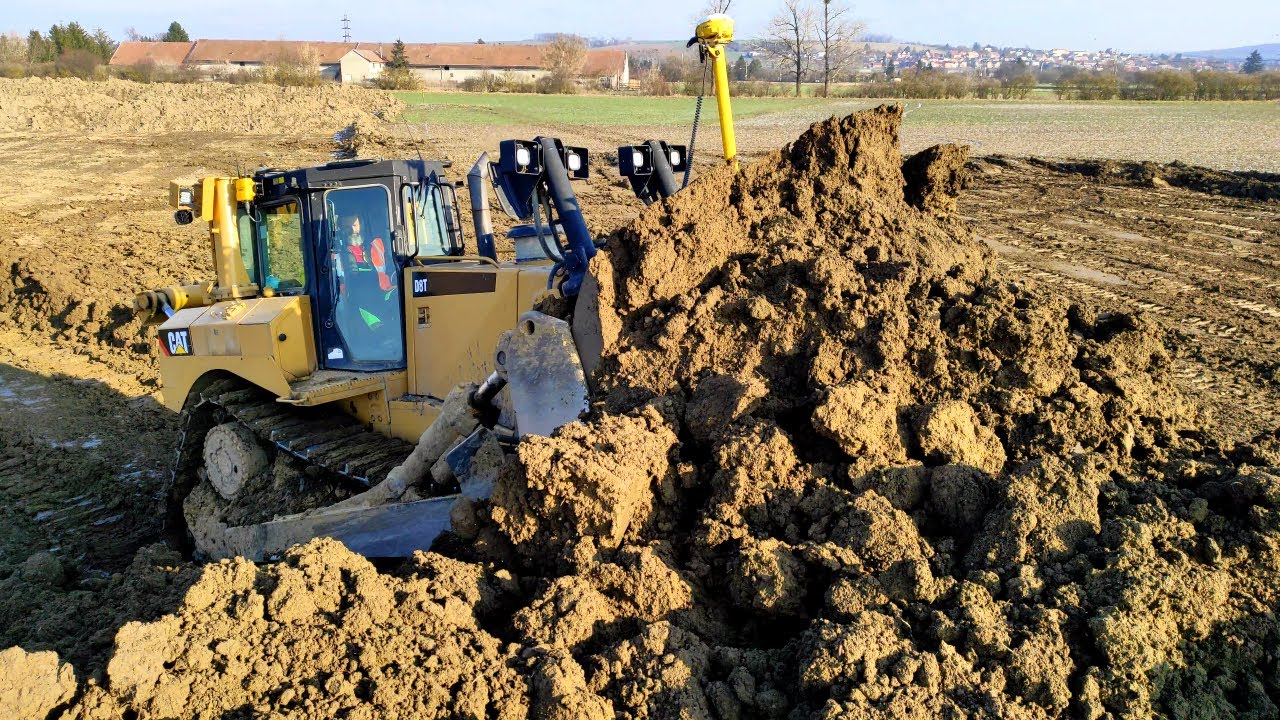 CAT dozers pushing the soil