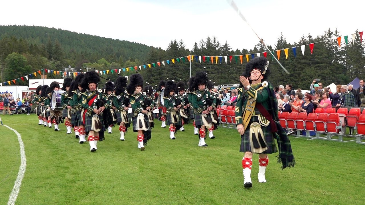 Huntly & District Pipe Band arena march opening the 2019 Lonach Highland Games in Strathdon Scotland