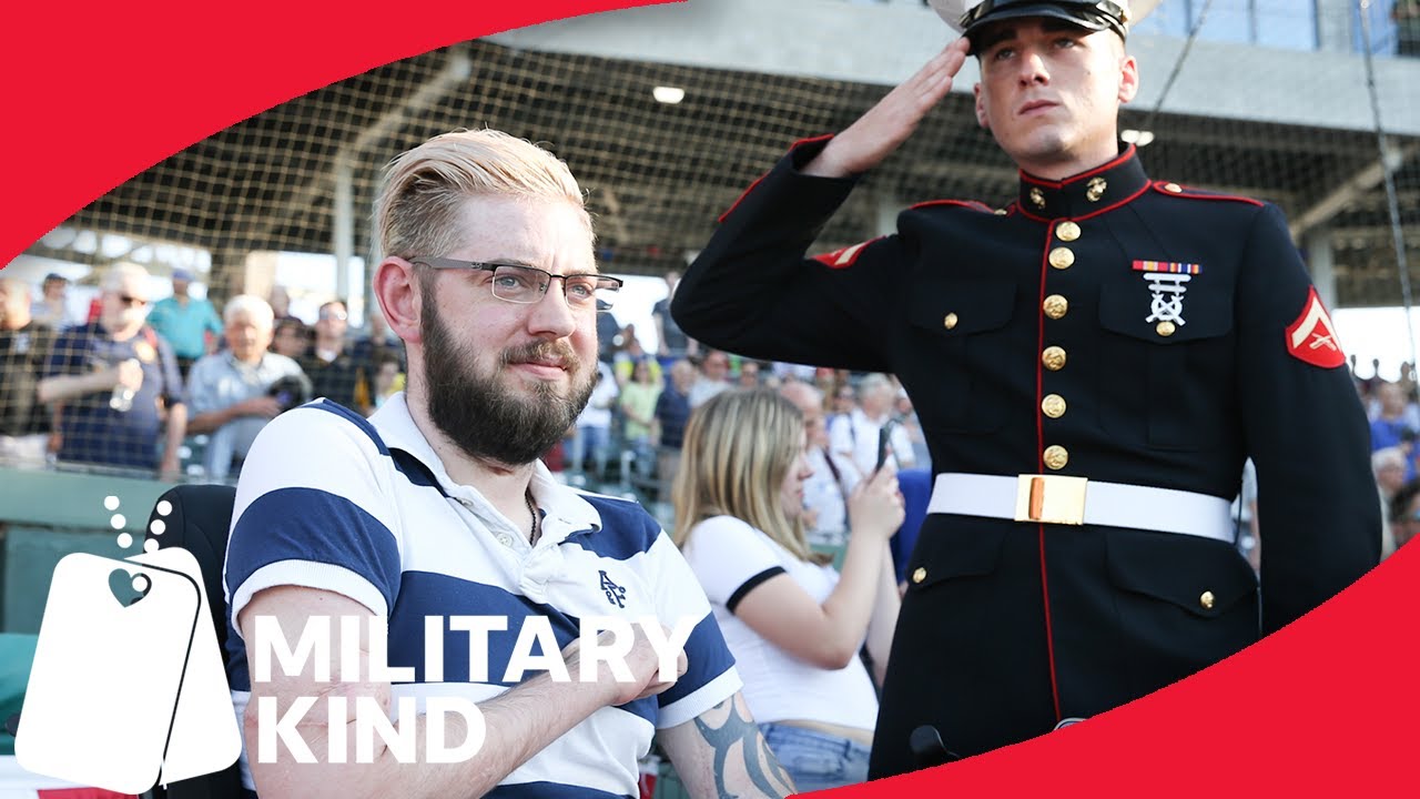 Marine vet throws out first pitch after double arm transplant