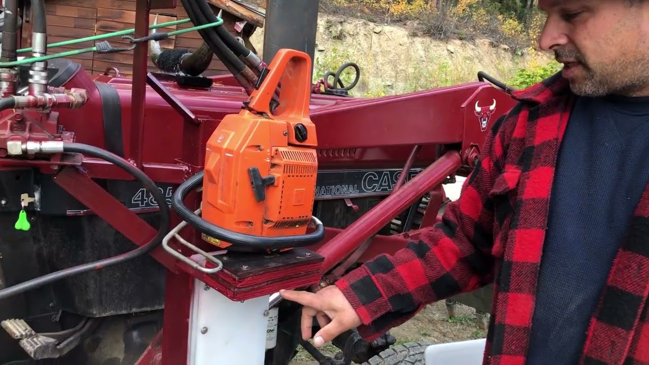 Tractor chainsaw holder