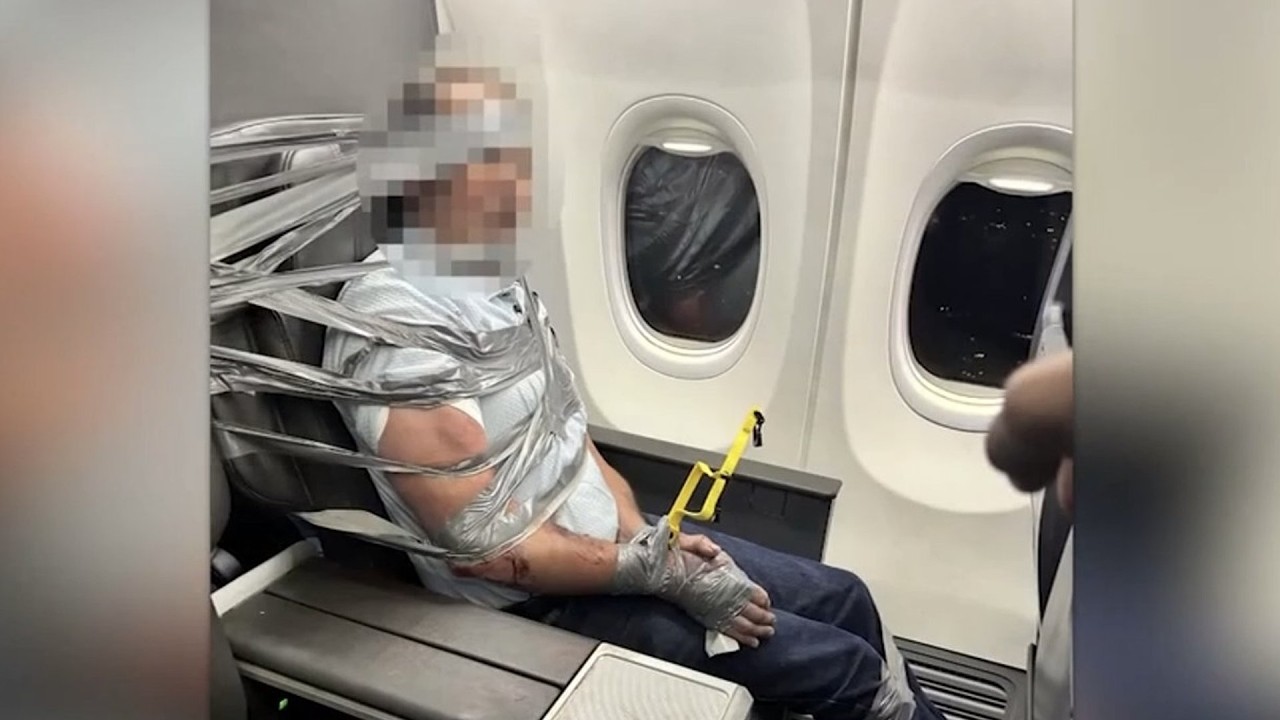 Disruptive passenger duct-taped to plane seat