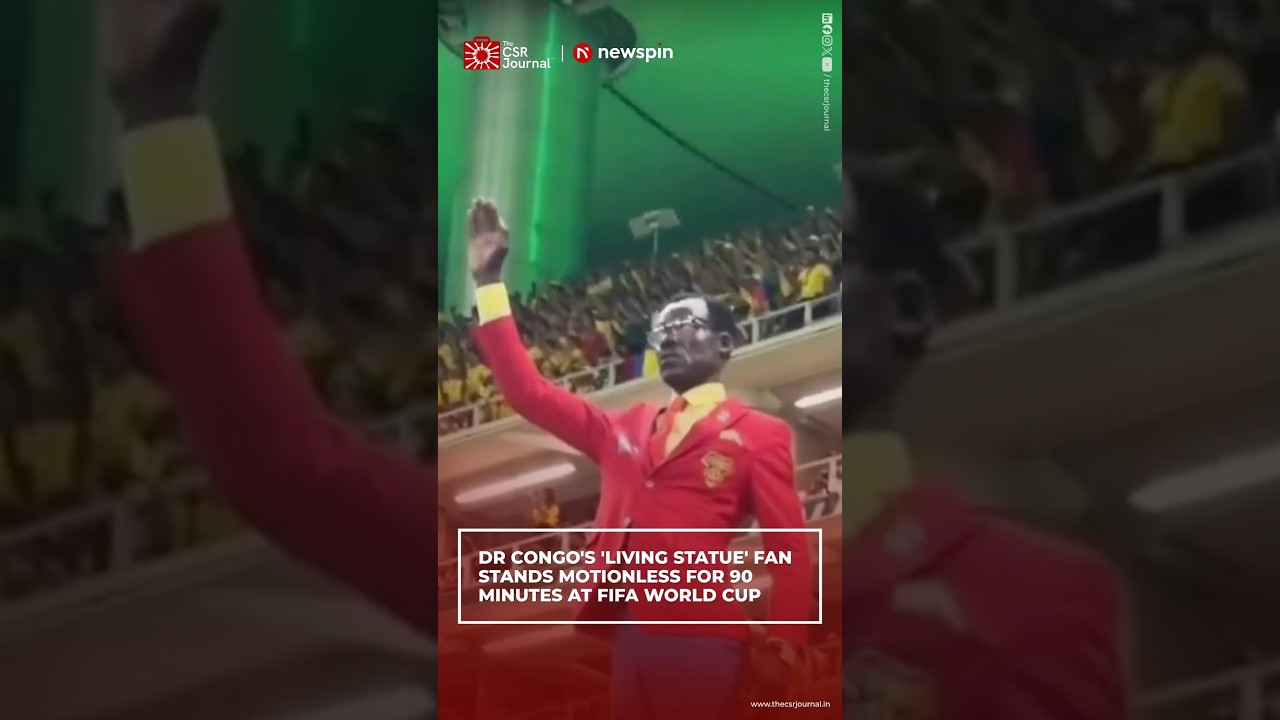 DR CONGO'S 'LIVING STATUE' FAN STANDS MOTIONLESS FOR 90 MINUTES AT FIFA WORLD CUP