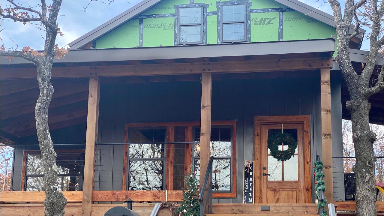 Siding Our DIY Cabin | Board and batten metal and cedar trim