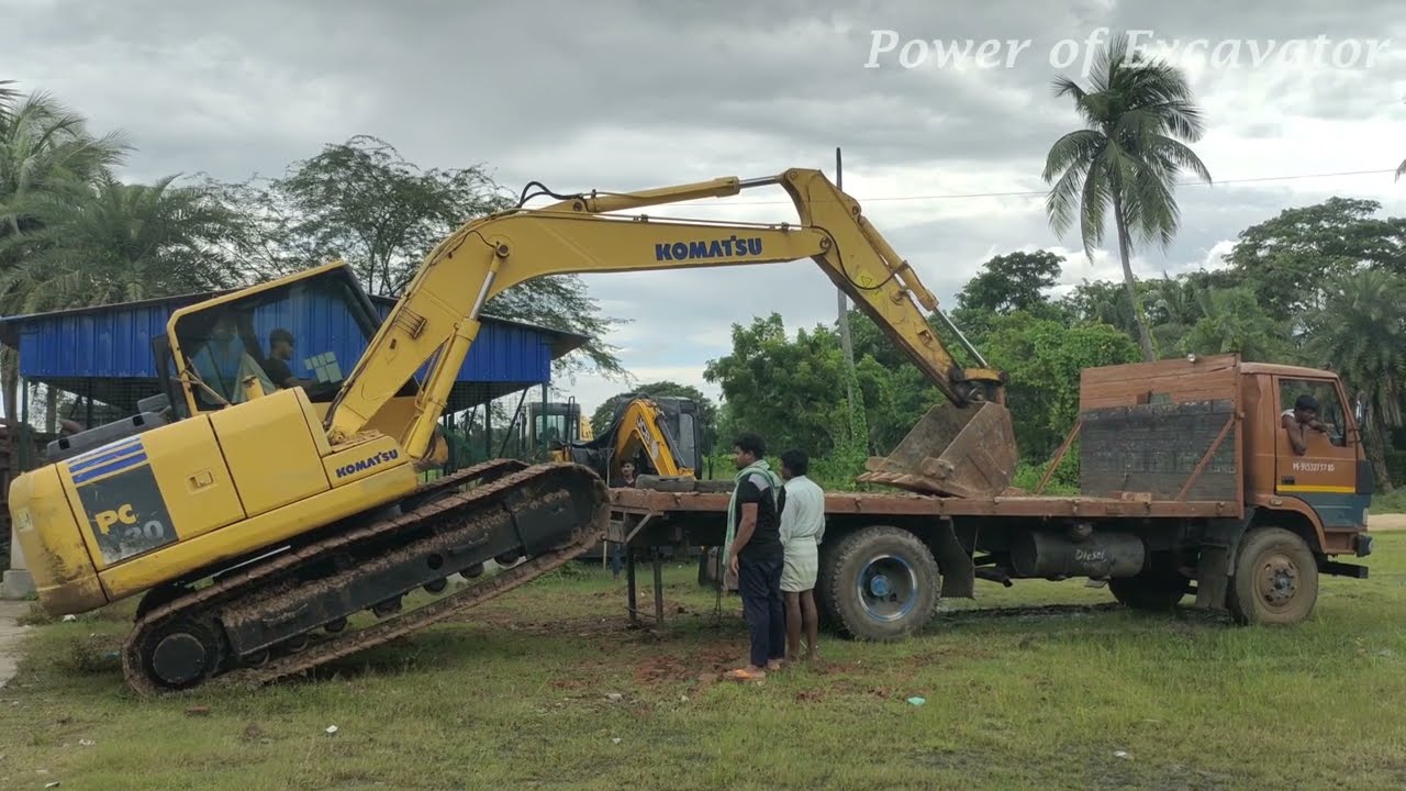 komatsu pc 130 unloading truck
