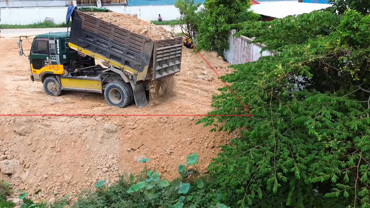 Nice work to complet pushing rock & soil   by KOMAT'SU D37P dozer and 5ton trucks landfill delete