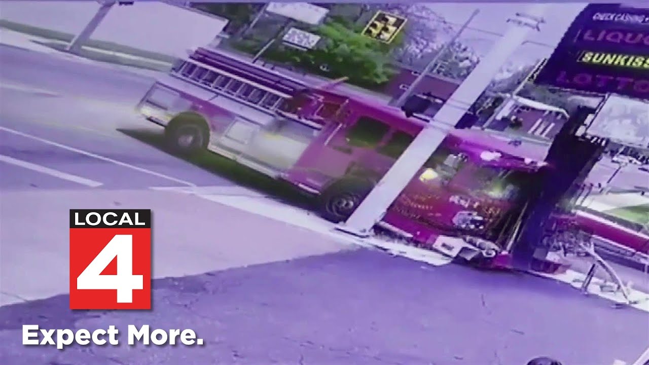 Detroit fire engine caught on video crashing into truck, store sign