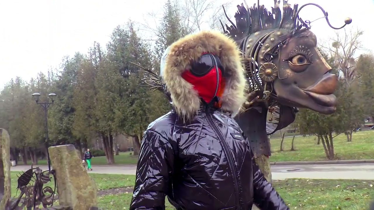 Black glossy ski suit and gas mask, Black glossy warm leather ski suit. Winter ski suit, ski mask