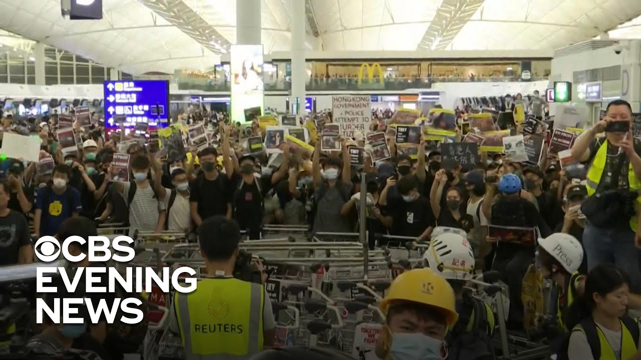 Chaos at Hong Kong airport as police clash with protesters