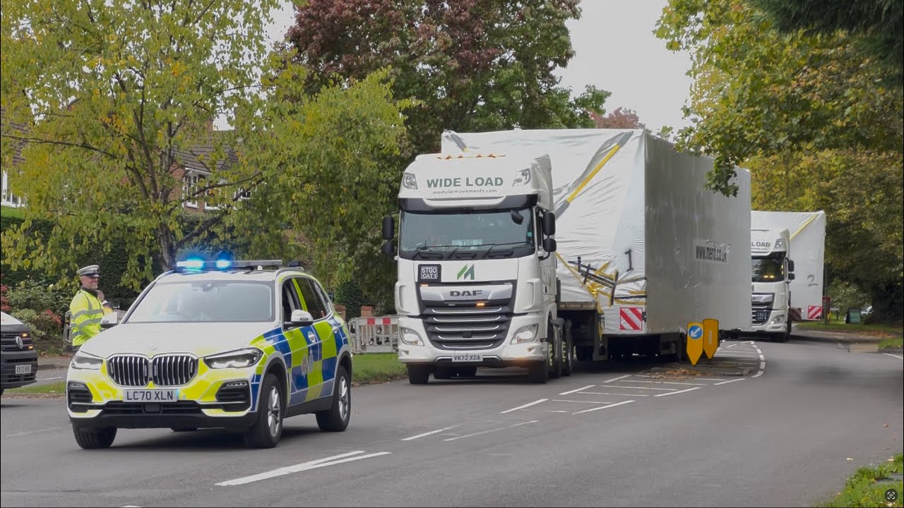Abnormal Load driving through Woking, escorted by Surrey Police