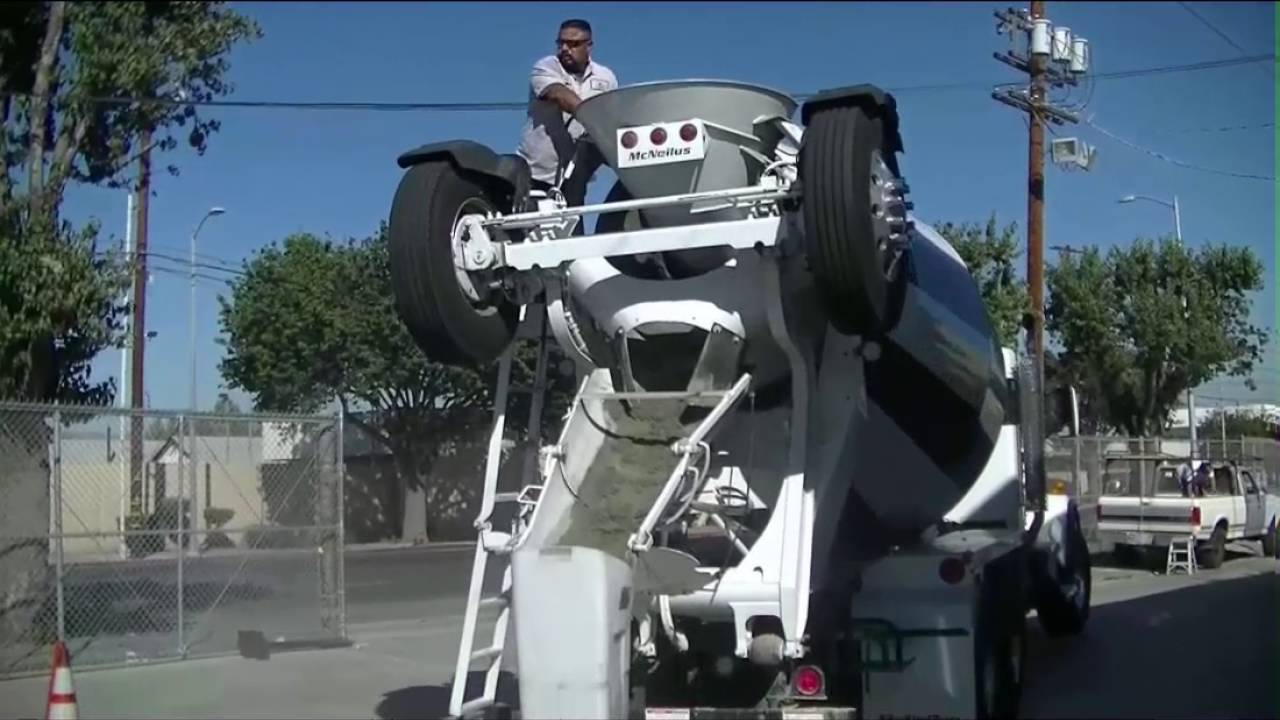 Washout Watchdog | Ready Mix Driver Rinsing Out Chutes on Jobsite