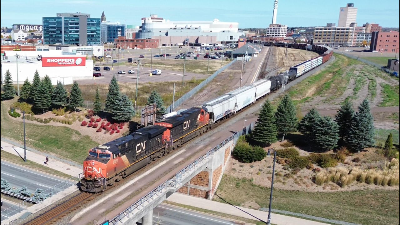 Awesome Aerial 4K View! Long Manifest Train CN 507 passing thru Downtown Moncton, NB
