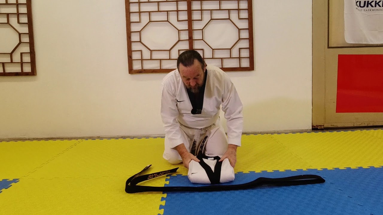 Dobok falten, G&uuml;rtel binden