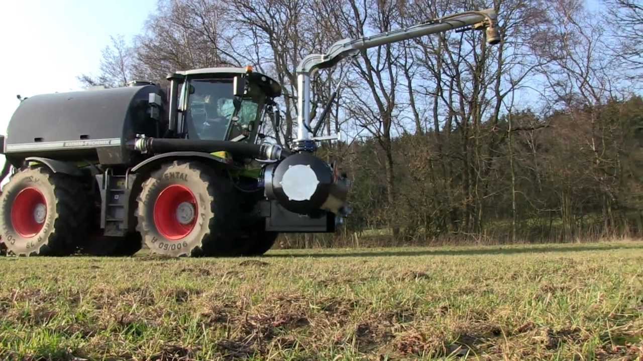 Xerion 3800 schlitzt G&uuml;lle + MAN LKW Zubringer