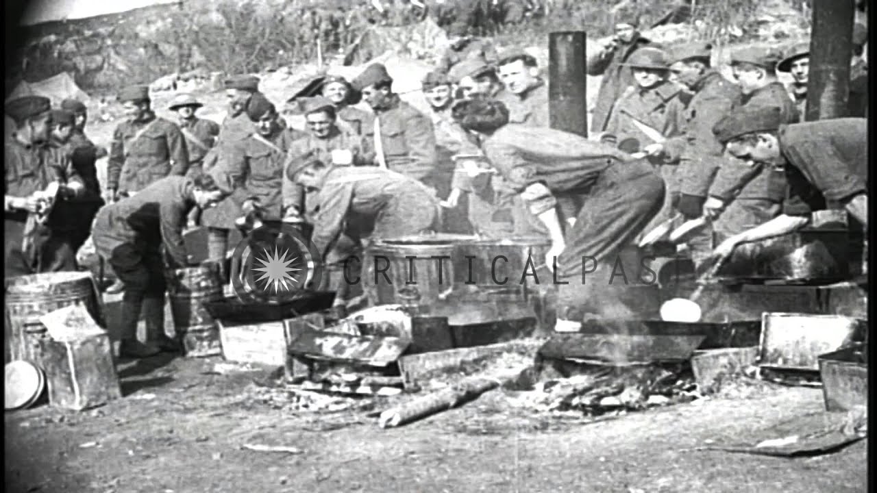 US troops unload hay from railroad cars, cook food and eat in La Cheppe, France. HD Stock Footage