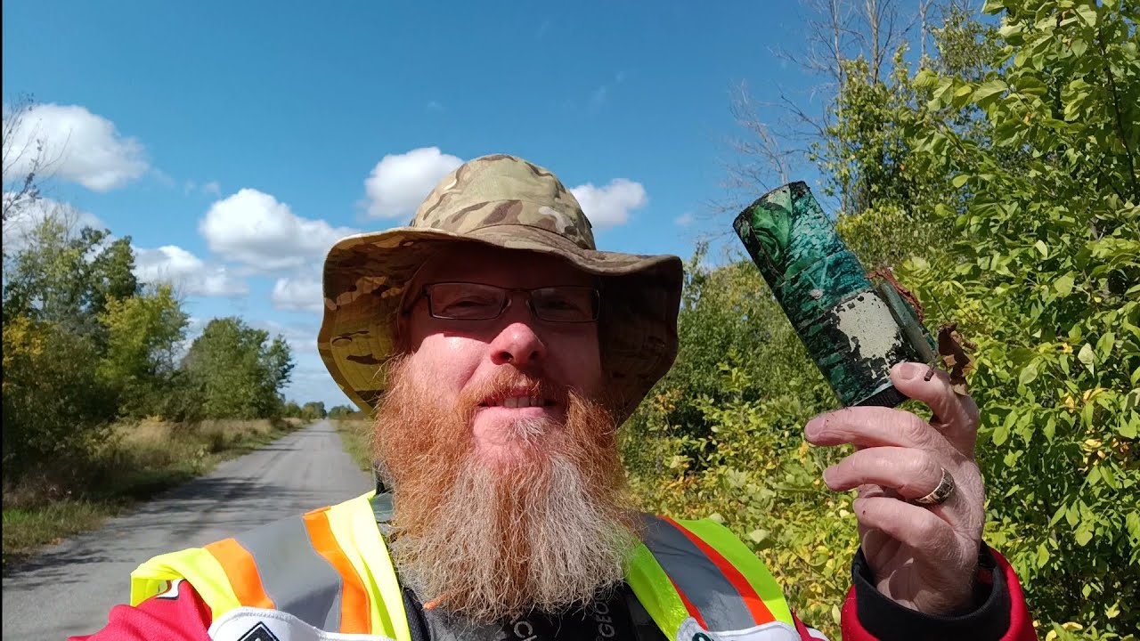 Geocaching, looking for a lost cache. (01090725)