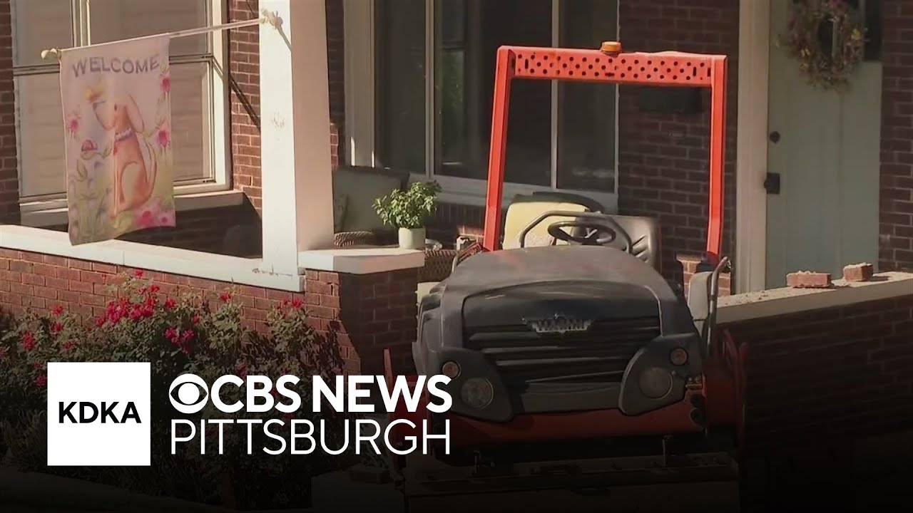Road roller crashes into Pittsburgh home