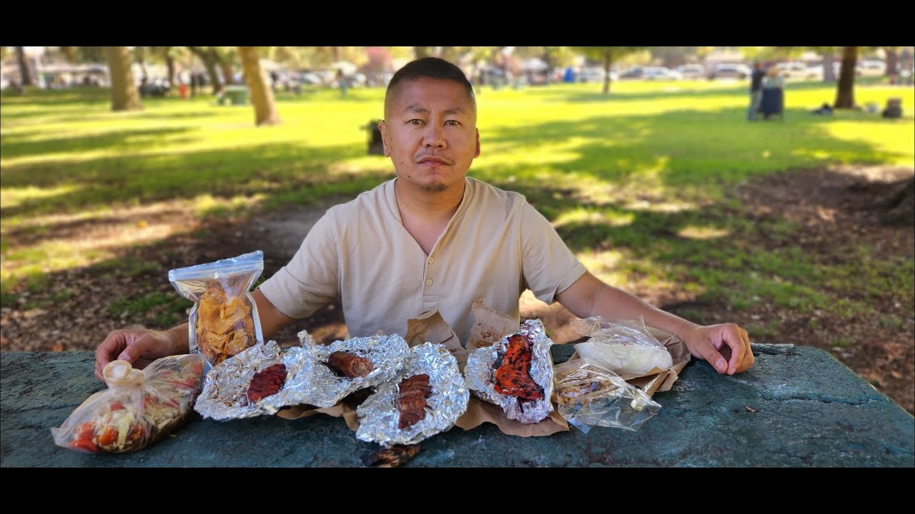 Eating Lao & Combodian Street Food at Angel Cruz Park in Stockton California for the first time.