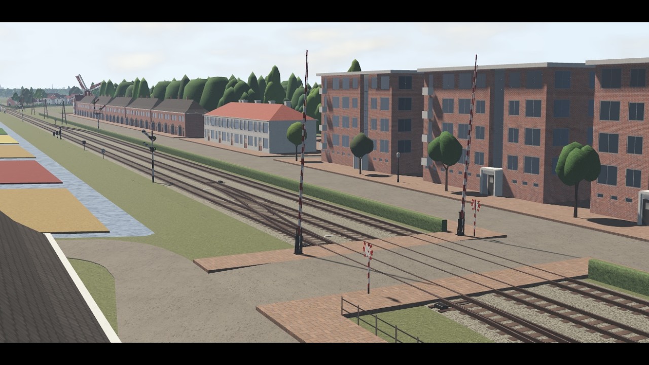 An empty gated Dokmuiden crossing occasionally being passed by trains