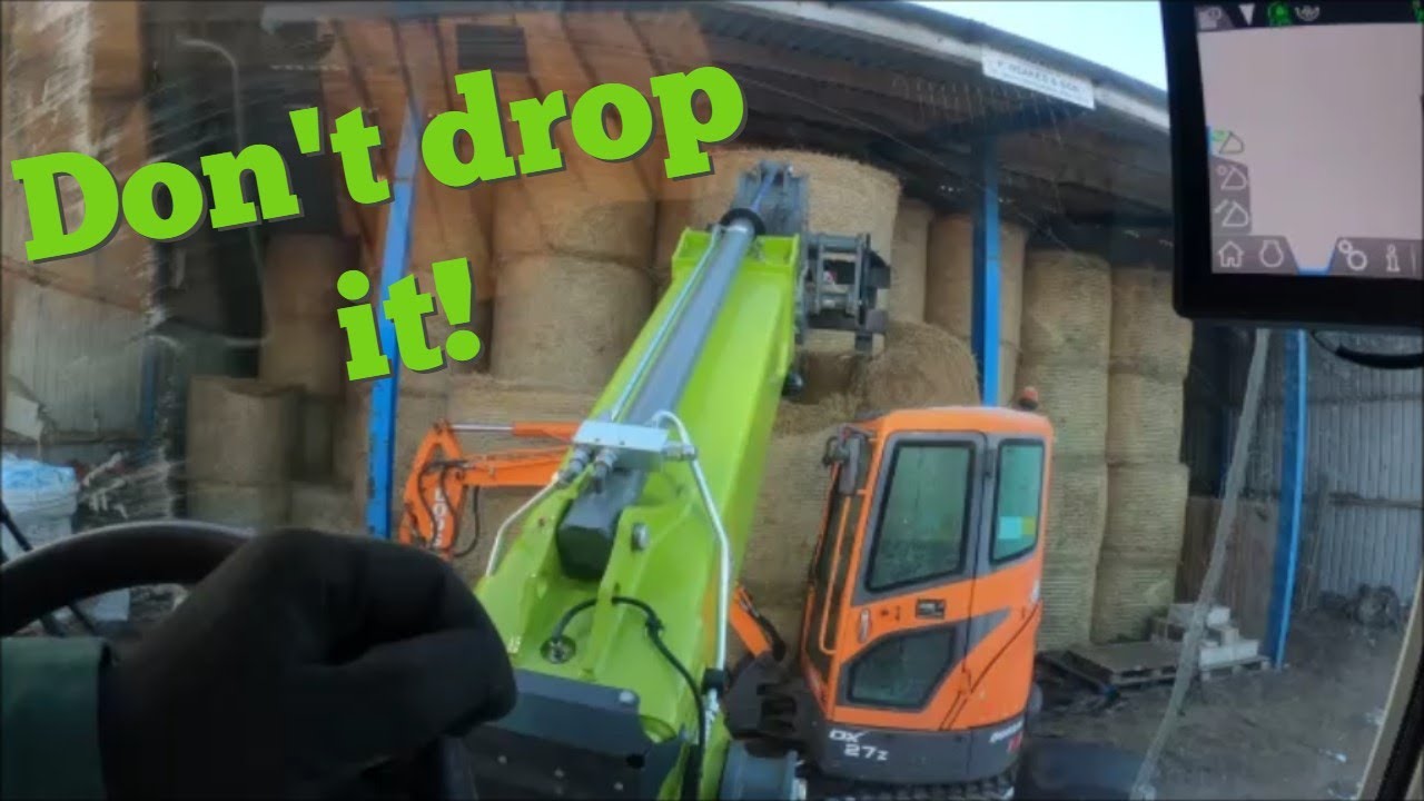 16/12/22.  CLAAS 738 T Torion  On with the pallet forks part two.