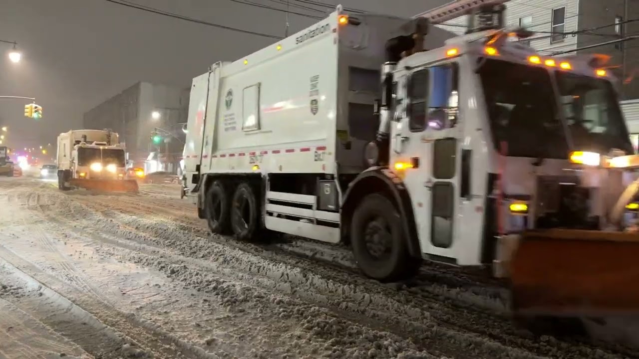 DSNY PLOWS & SALT SPREADER PLOWING & SALTING DURING WINTER STORM FERN IN THE BRONX, NEW YORK CITY.