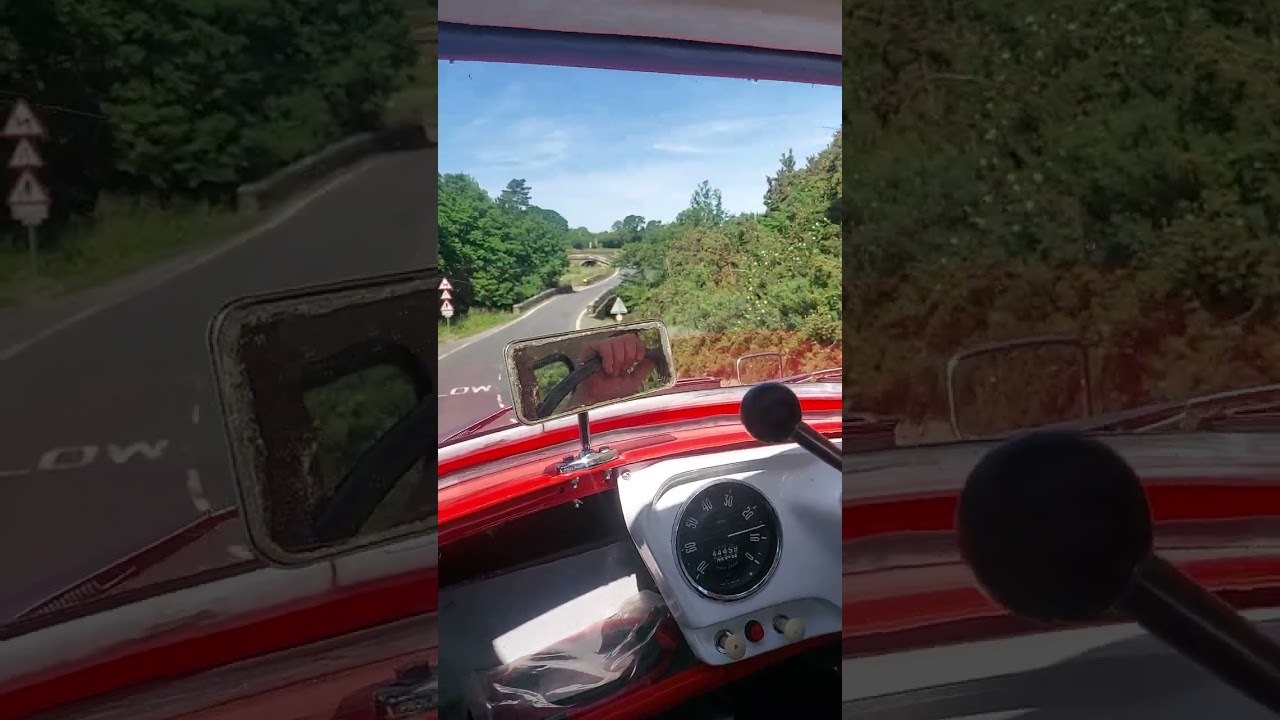 Bond minicar  mk f driving through  goathland  near Whitby