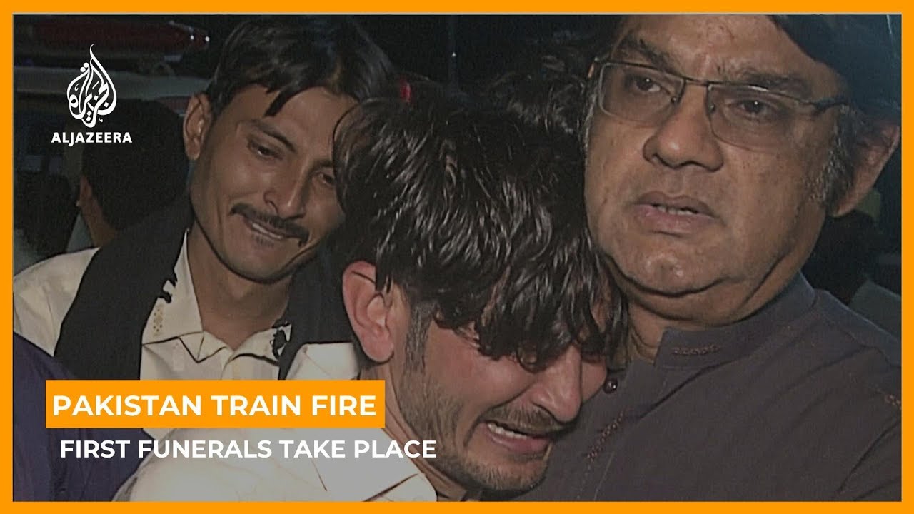 Funerals begin as town mourns victims of Pakistan train fire