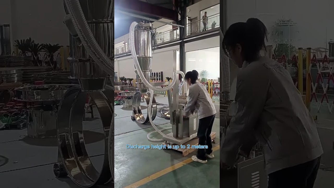 Vacuum conveyor with manual lifting support.