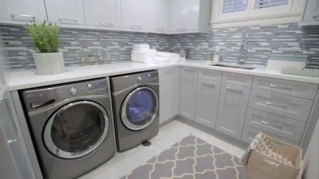 Interior design — Small, Storage-Filled Blue-Grey Laundry Room Renovation