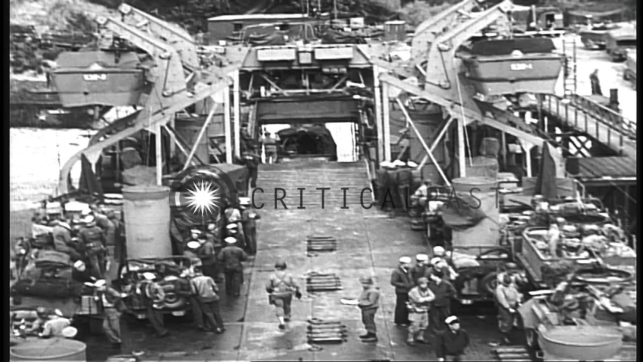 The upper deck of a US LST (Landing Ship, Tank) is loaded with army vehicles at F...HD Stock Footage