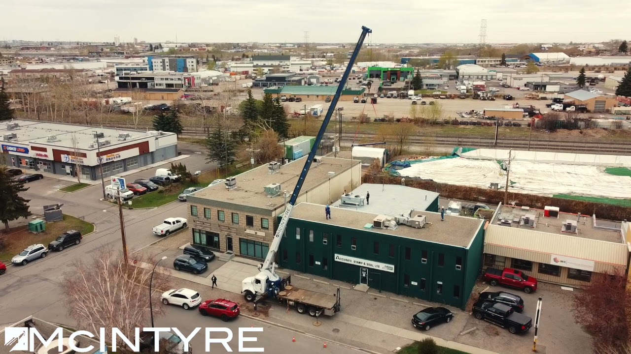 Mcintyre Crane & Rigging - Removing and transporting a HVAC unit