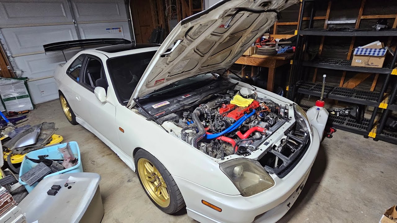 97-01 Prelude hood strut install.