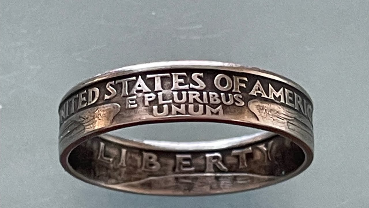 Antique refinishing a copper clad coin ring