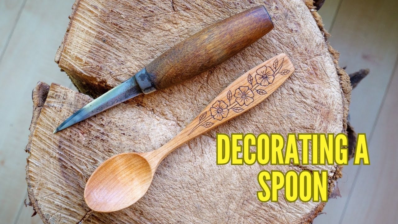 Decorating A Spoon. Traditional Art Of Kolrosing.