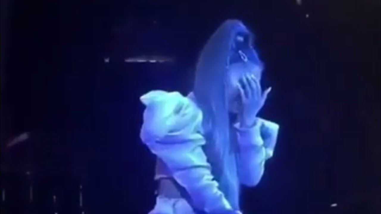 Ariana Grande crying on stage while performing R.E.M