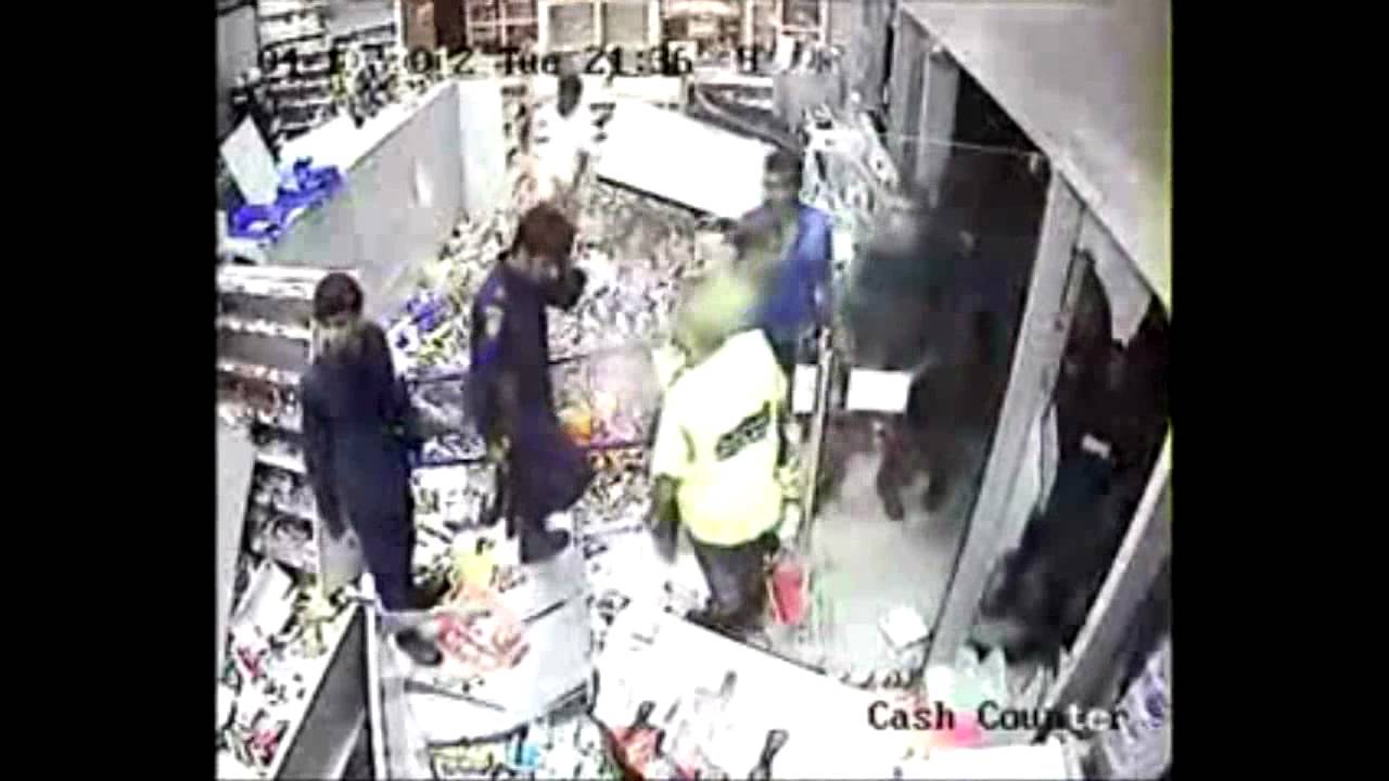 Thugs backed up by police attacking Jawad 24 Hours supermarket HD