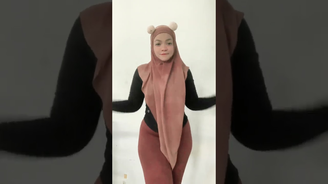 Dancing in Style: Hijabi Girl's Performance You Can't Miss! 🌟