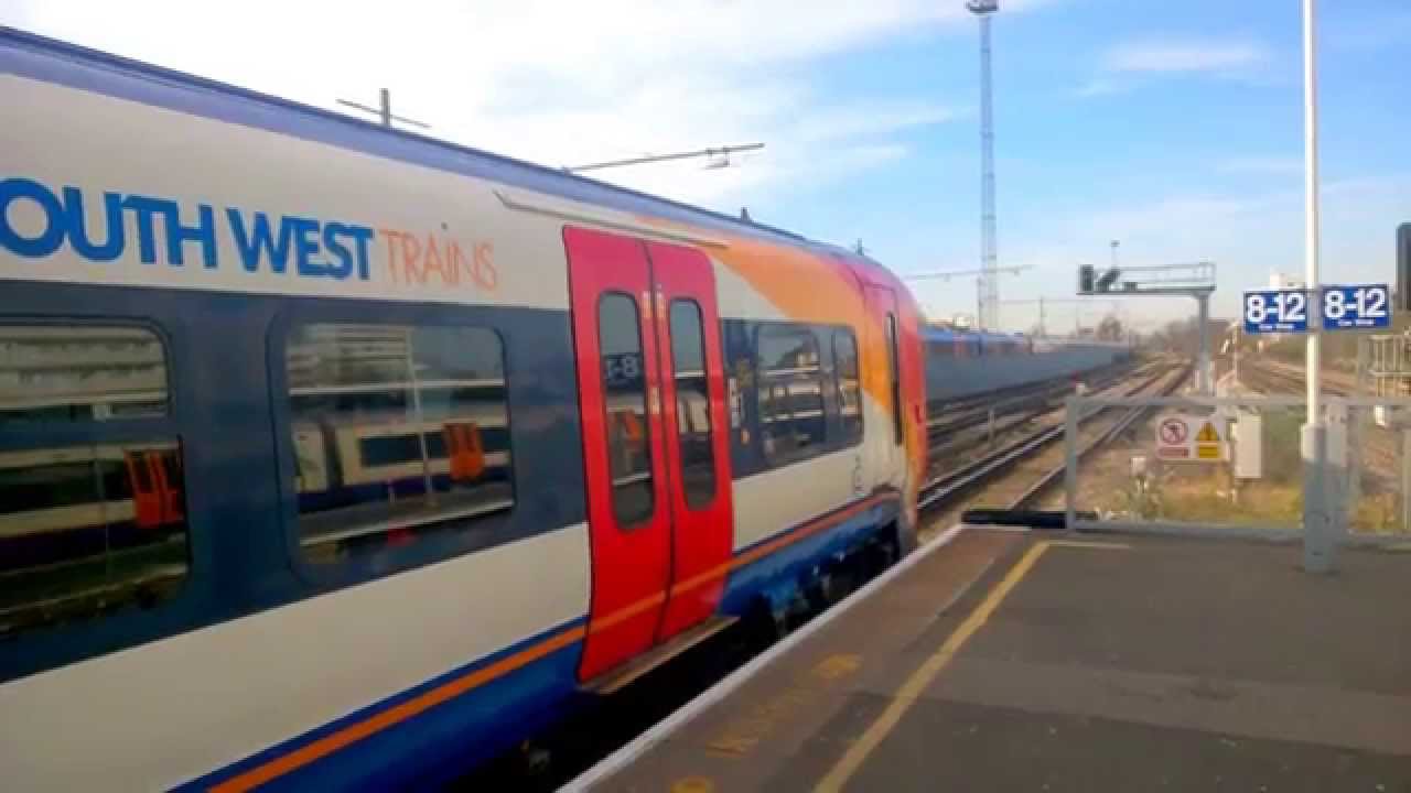 2X SWT Class 458 units departing Clapham Junction